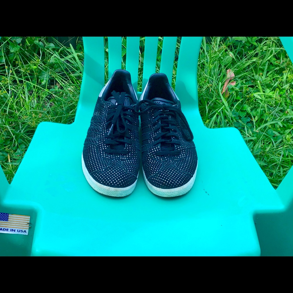 Adidas Gazelle black and silver sparkle sneakers.